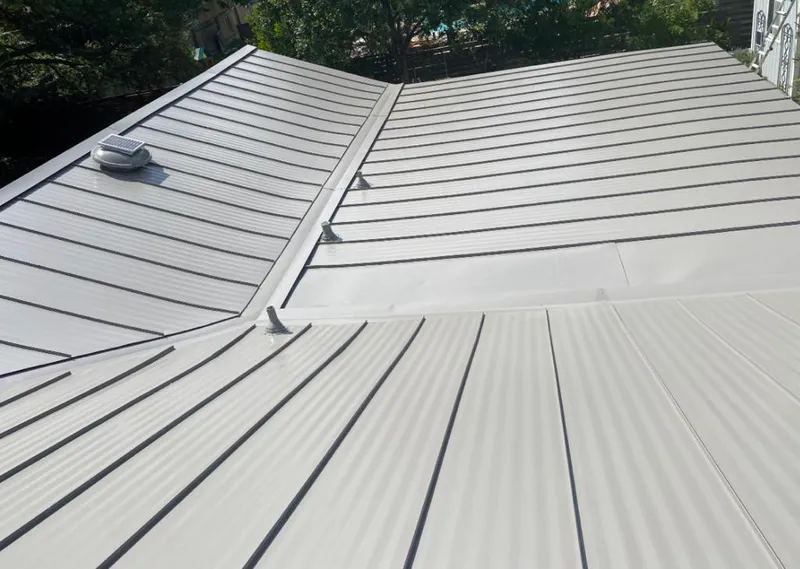 Solar attic fan installed on a metal roof for Roof Ventilation in Oakdale
